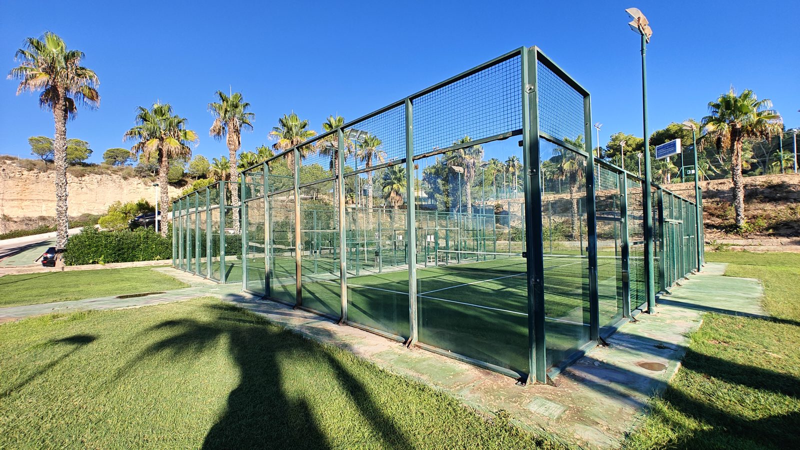 Glass-walled padel courts at the Campoamor resort sports club