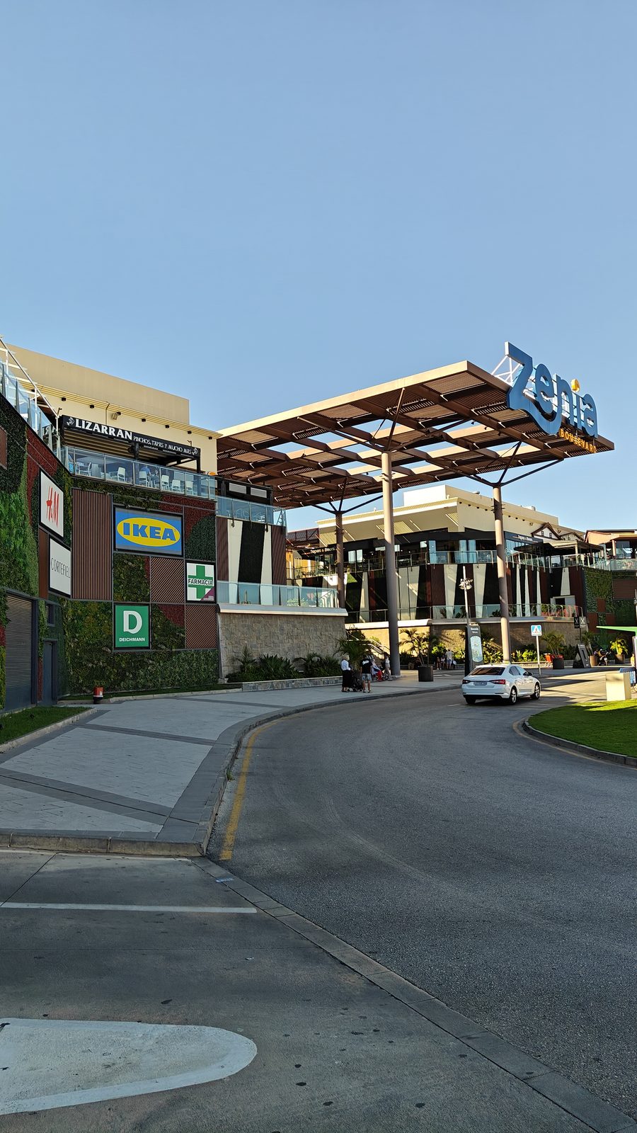 Approach road curving towards the Zenia Boulevard entrance