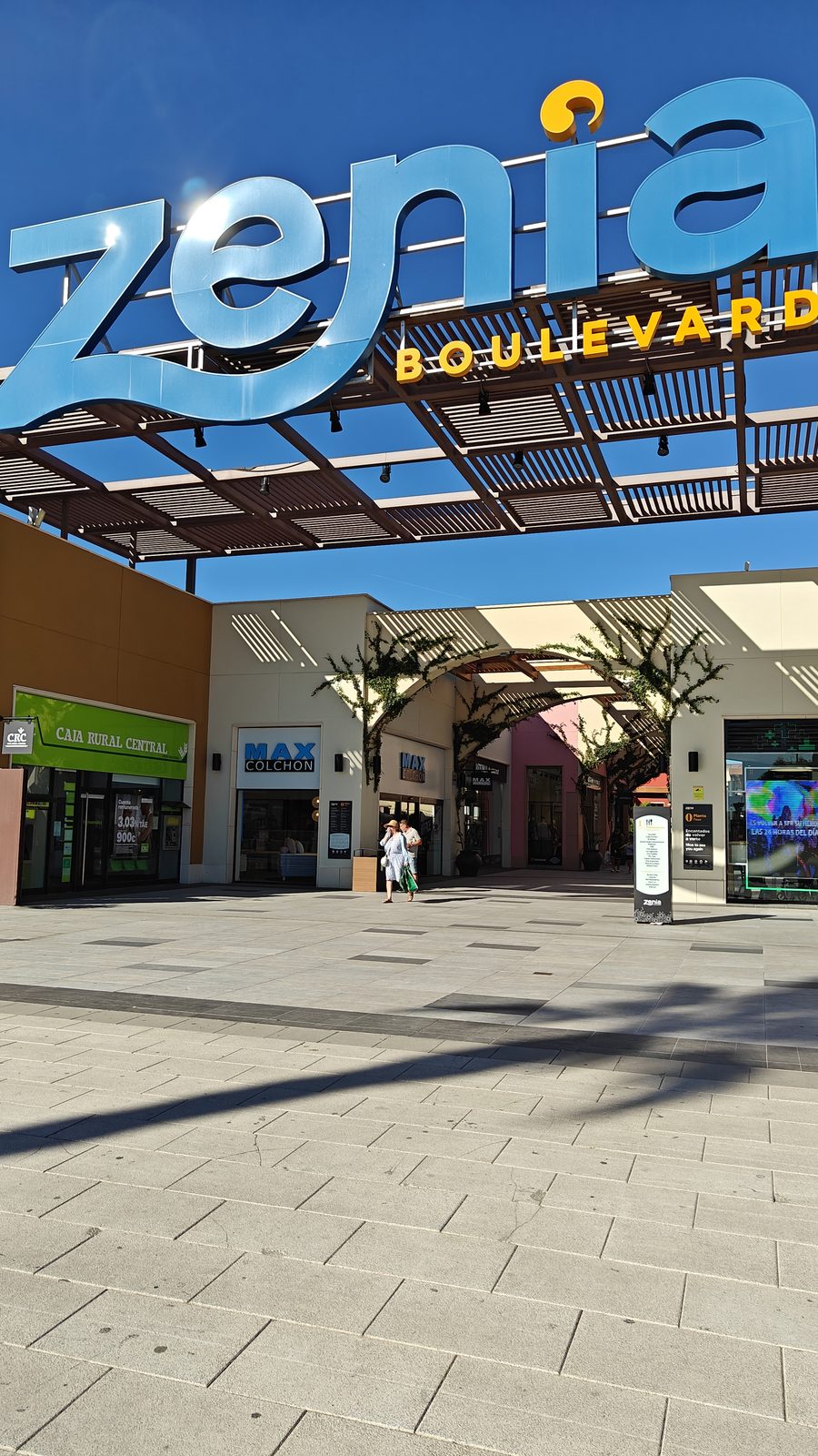 Zenia Boulevard sign above an open-air shopping walkway