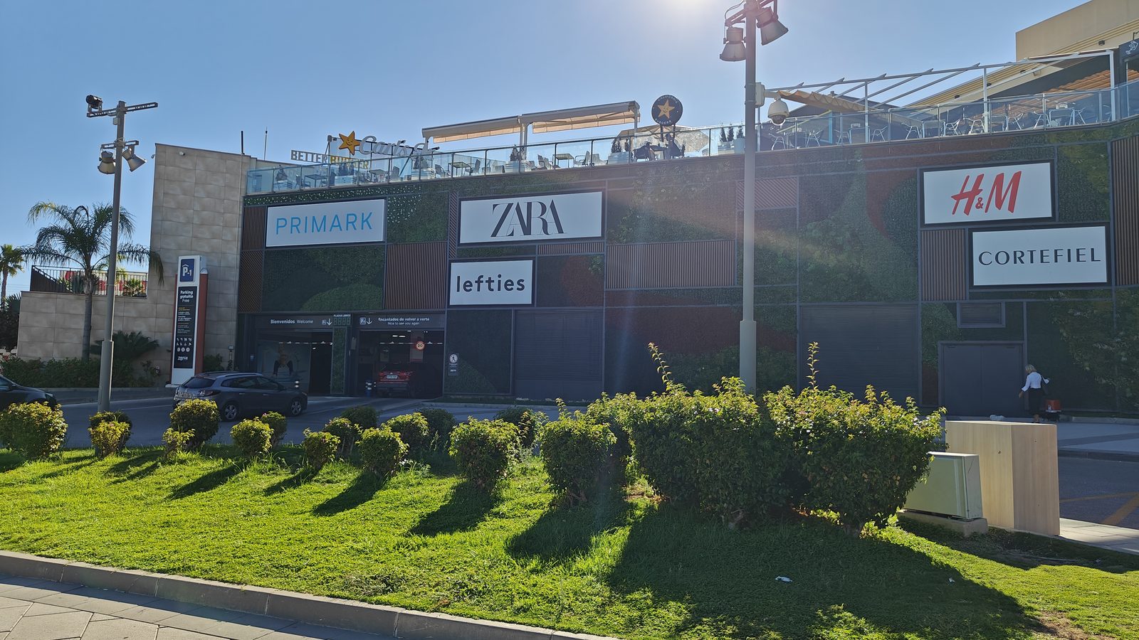 Fashion store frontages along the outside of Zenia Boulevard