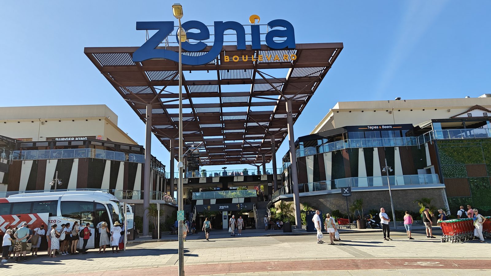 The main entrance canopy at Zenia Boulevard, with the centre's name above it