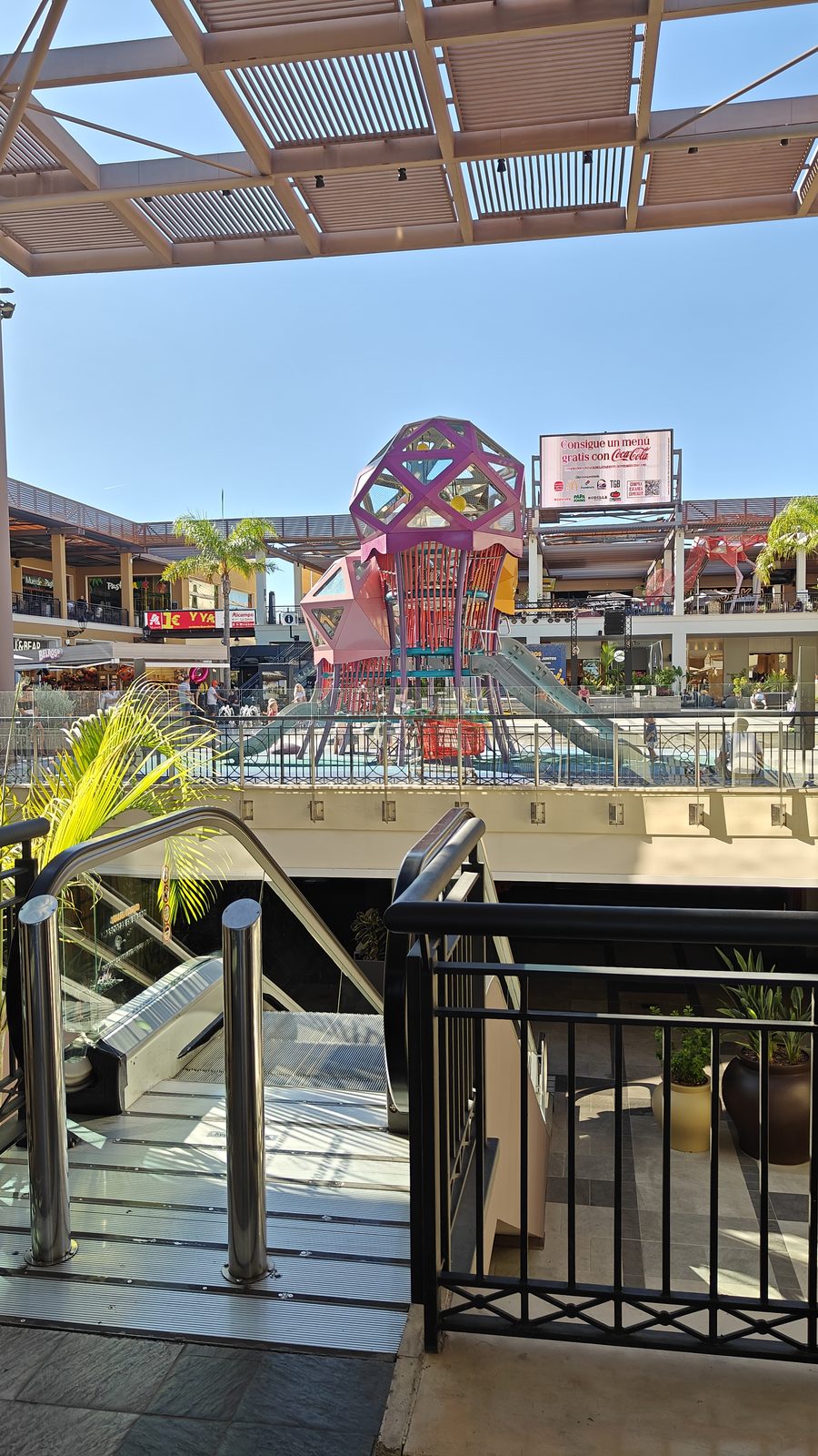 View across Zenia Boulevard towards a large colourful play sculpture