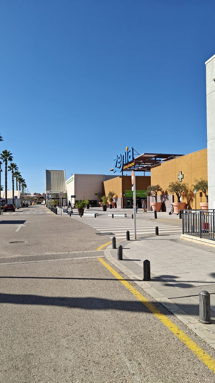 Road running past store frontages at Zenia Boulevard